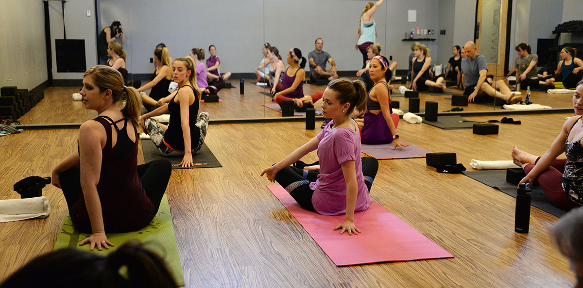 Shelby in yoga class with other colleagues. 