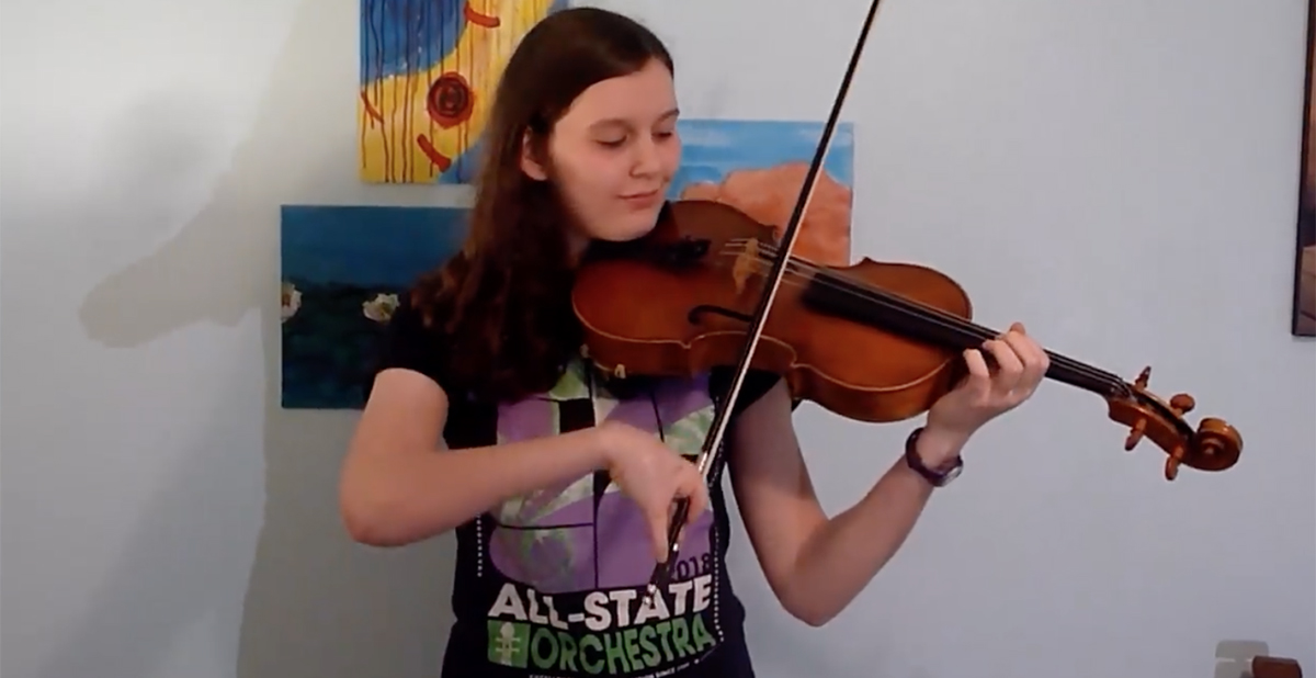 Hand patient, Gina, playing the viola.
