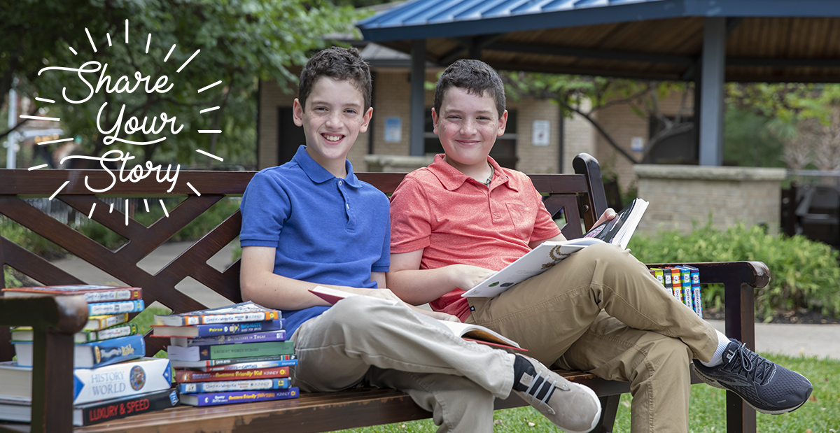 matthew and thomas outside with books