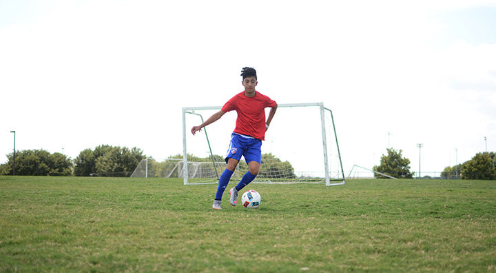 Young athlete playing soccer