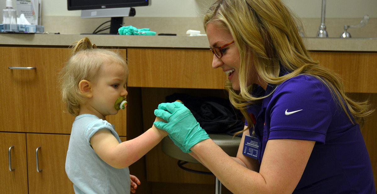 Baby patient working with Texas Scottish Rite Hospital for Children nurse