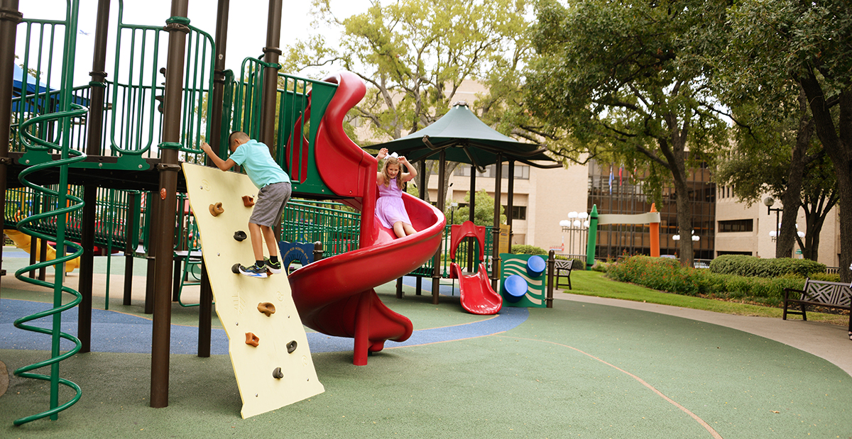 Two children playing on the playground