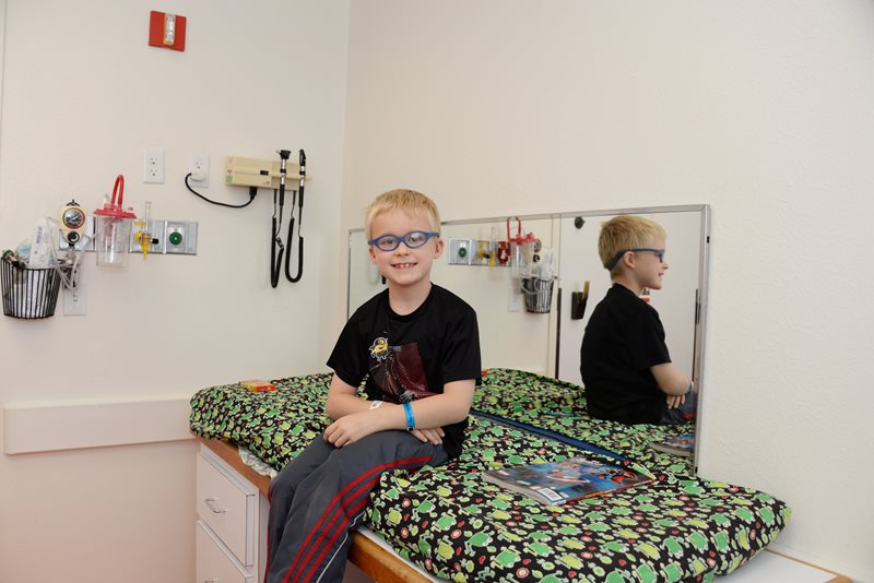 Pediatric developmental disability patient in exam room at Texas Scottish Rite Hospital for Children