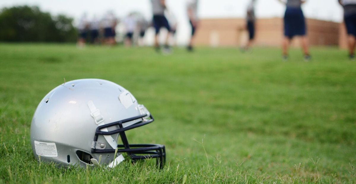 Football helmet on high school football field