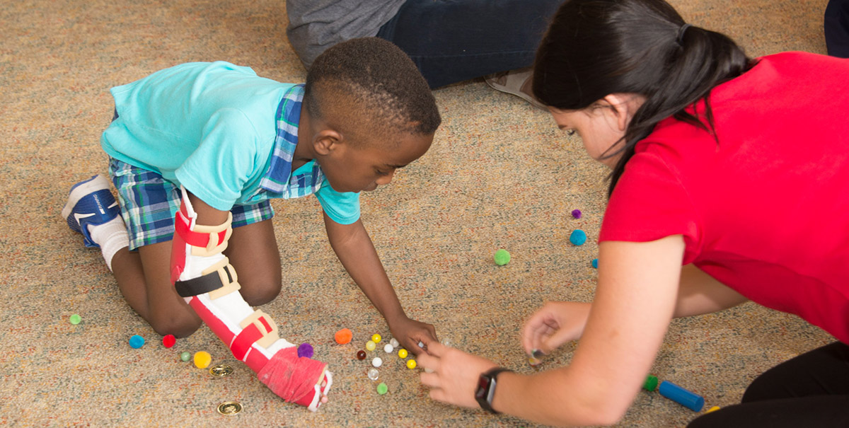 A child participating in the CIMT program.