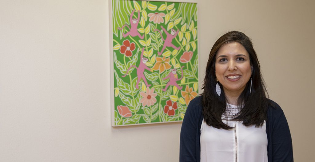 chetna in front of painting