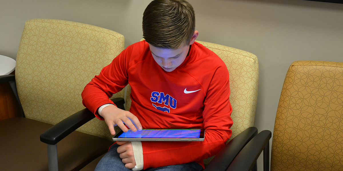 Patient answering a questionnaire before going to his appointment.