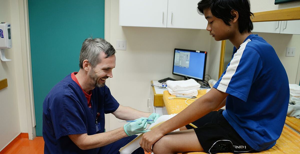 Dwight with Texas Scottish Rite Hospital for Children patient