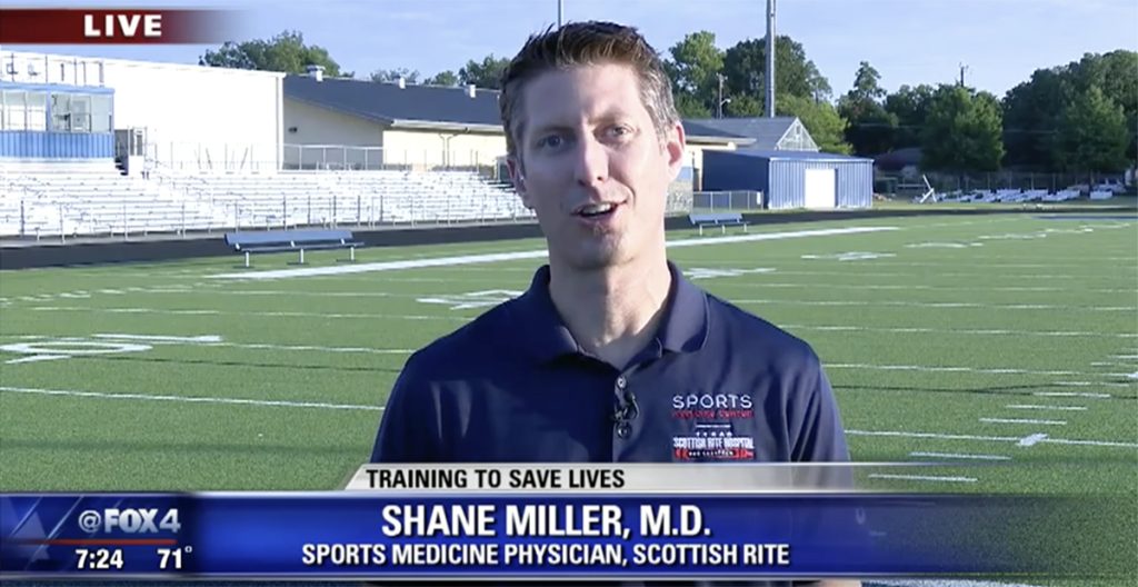 Dr. Miller on football field