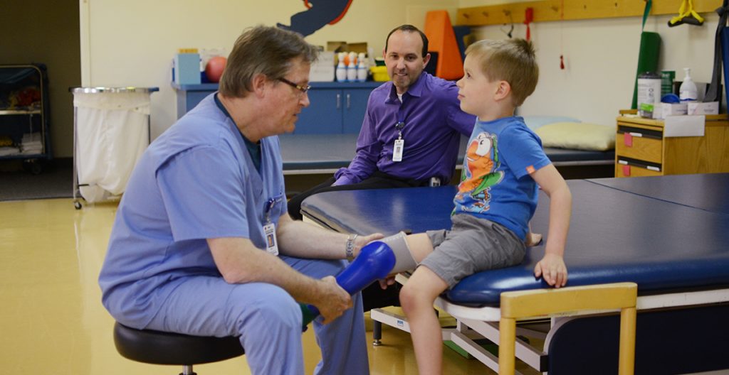 don in physical therapy room with patient