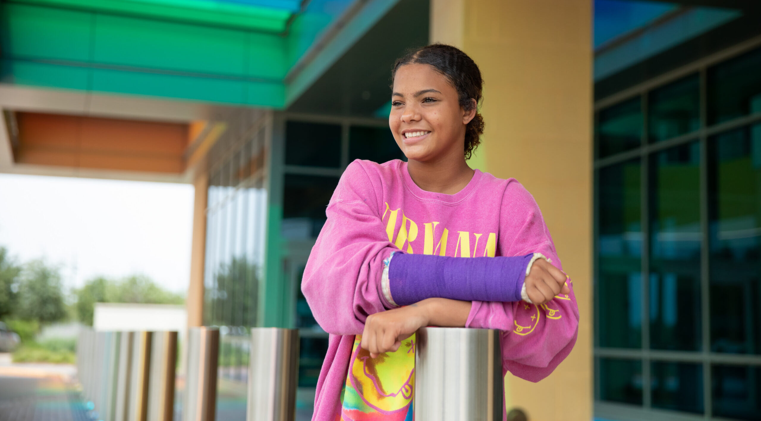 Young girl with a purple cast.