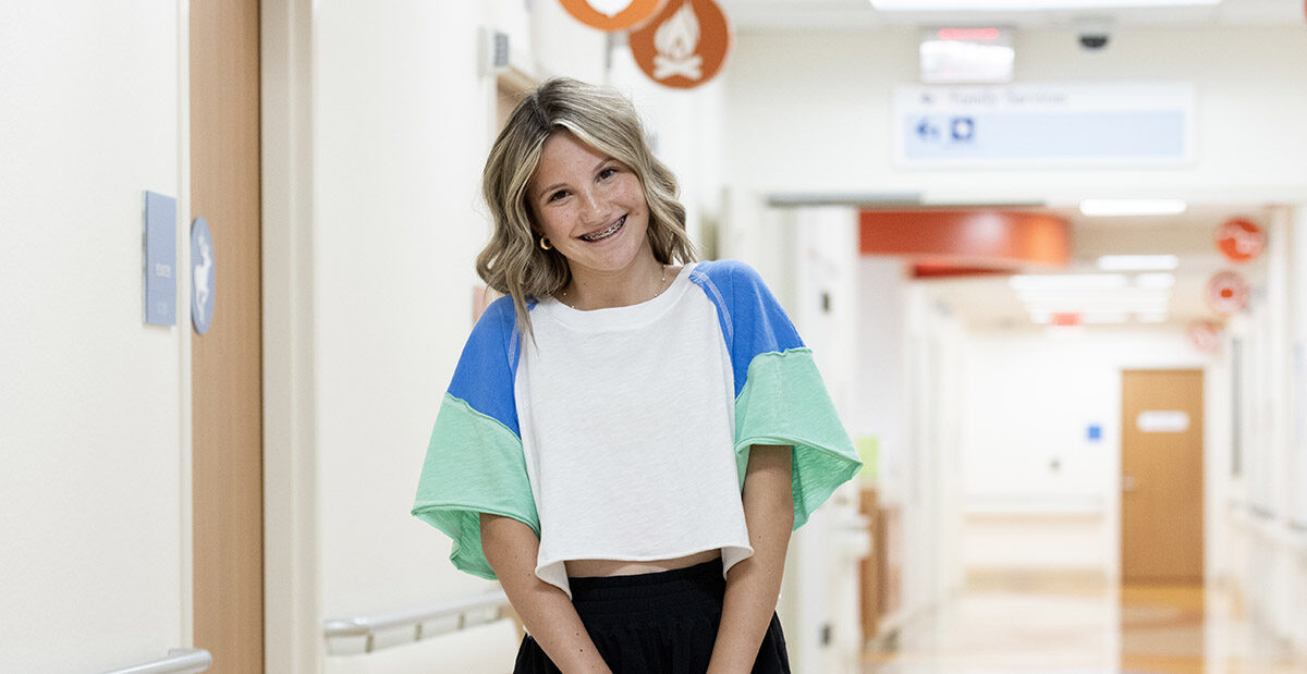 Kyler standing in hall way at Scottish Rite Hospital.