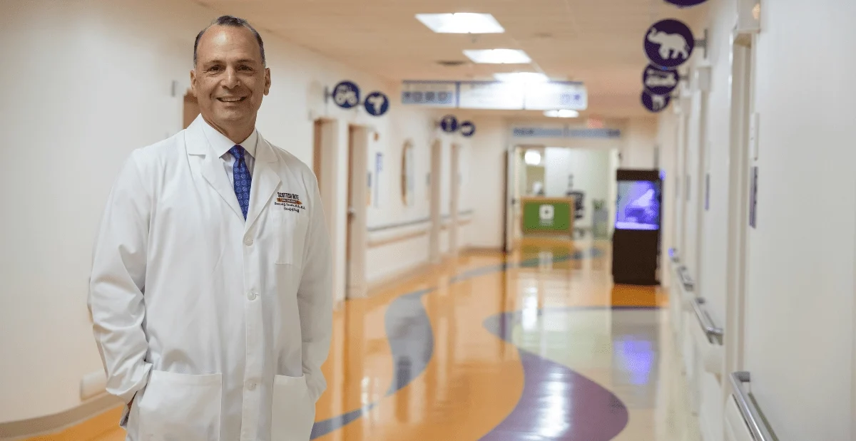 Spine Doctor Dan Sucato is standing in a hallway at the hospital.