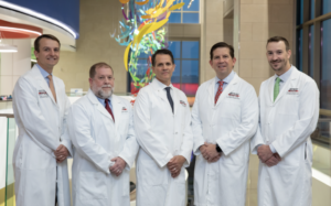 a group of 5 Scottish Rite sports medicine doctors pose for a photo