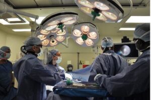 sports medicine doctors performing a procedure in an operating room