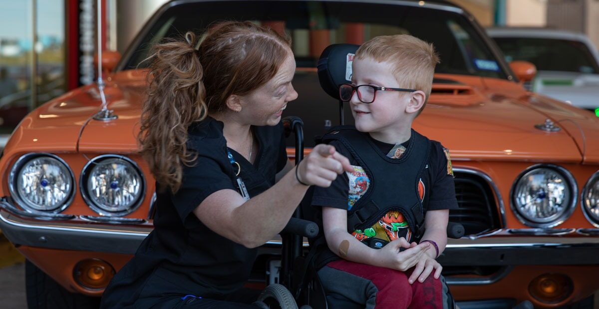 Physical therapist working with a cerebral palsy patient.